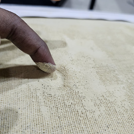 Close-up of the Tayammum surface showing fine clean natural dust for performing Islamic dry ablution.