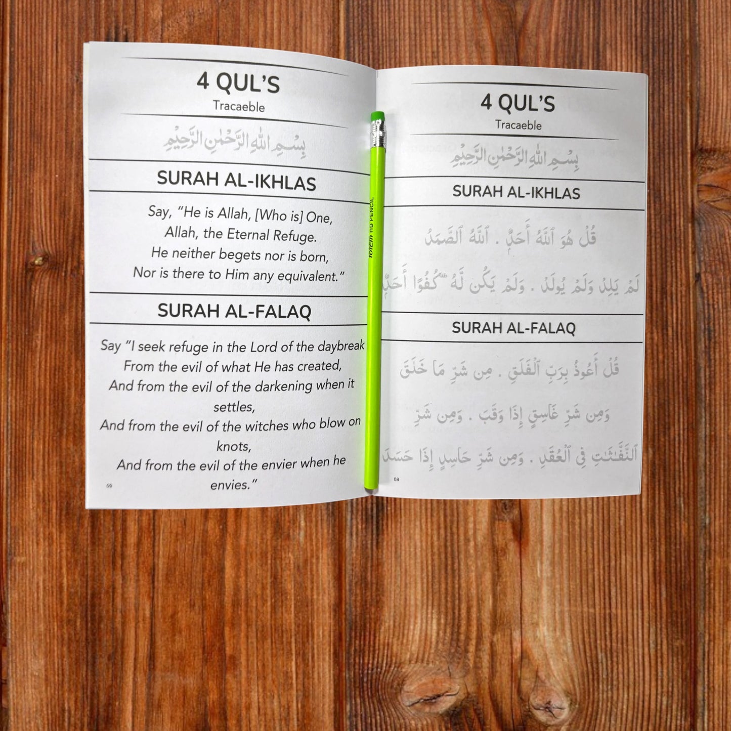 Inabah Store Islamic traceable book set open to 4 Quls and Surah Al-Ikhlas pages with a green pencil on top.